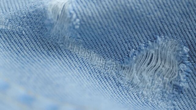 Ripped blue jeans denim fabric texture