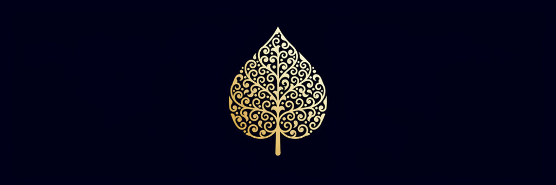 Golden leaf shape with intricate filigree swirl patterns isolated on a dark navy blue background, for luxury branding, and decor