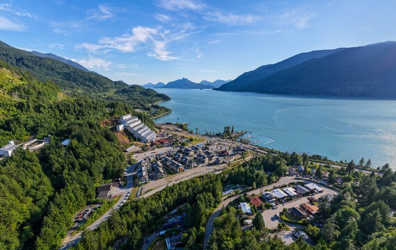 Aerial View of Britannia Beach Coastal Village Between Mountains and Turquoise Water in British Columbia