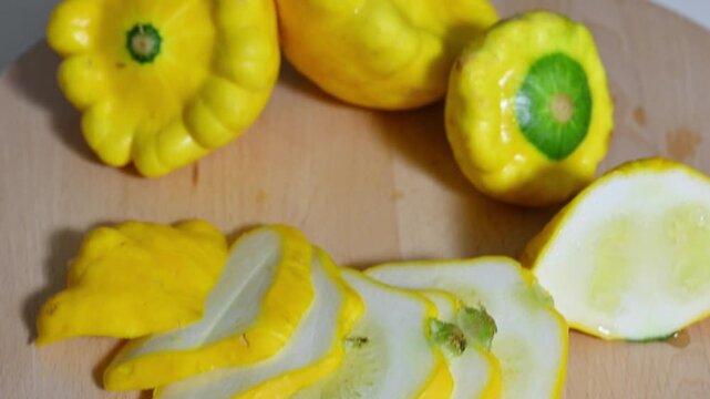 Top View Panning Out on Sliced Yellow Pattypan Squash