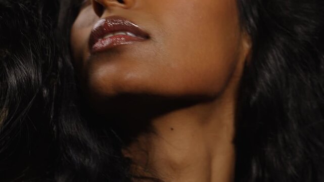 Two women in close-up shadowed portrait shots