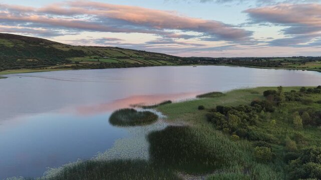 Carrowmore Lough, lake and mountains during the golden hour.