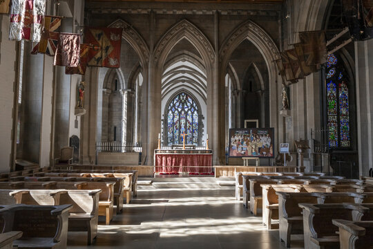 Sheffield, United Kingdom - 15 July 2026: View of Sheffield Cathedral interior with wooden pews, stone arches, and stained glass windows.