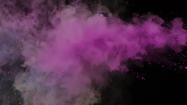 Overlay video transition, Vibrant explosion of multi-colored powder clouds isolated on a dark black background.