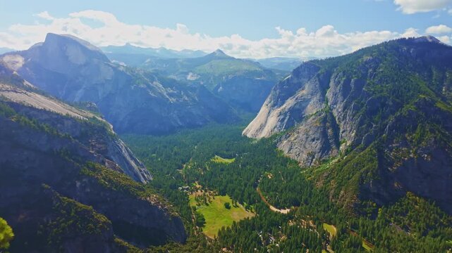 Sweeping panoramic view captures Yosemite Valley from the top of Yosemite Point trail