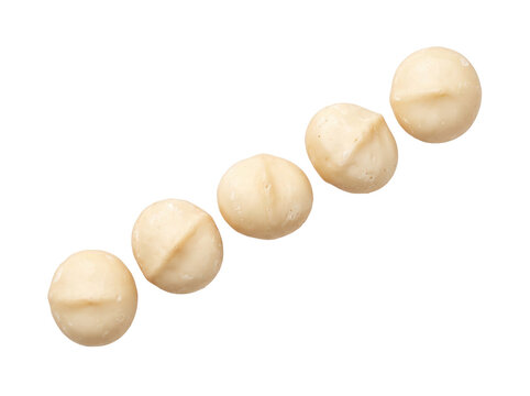 Shelled Macadamia Nuts Kernels in Diagonal Line Isolated on Black Background for Healthy Snack and Gourmet Cooking Ingredient