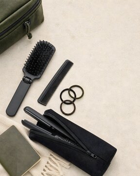 Hair Care Accessories and Styling Tools Laid Out on Neutral Background with Copy Space