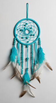 Dreamcatcher with feathers and beads hanging.