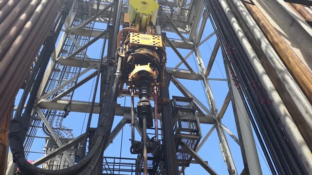 Upward View of Derrick, Top Drive System (TDS), Jack-Up Rig Mast Structure and Fingerboard Layout
