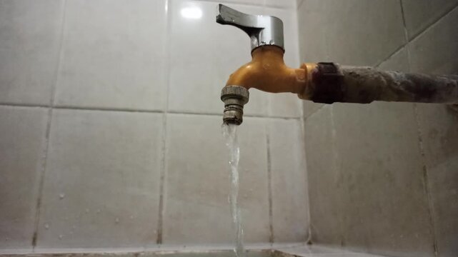 A water faucet equipped with a chrome lever handle for controlling water flow, showcasing a functional plumbing fixture commonly used in residential and commercial bathrooms or kitchens.
