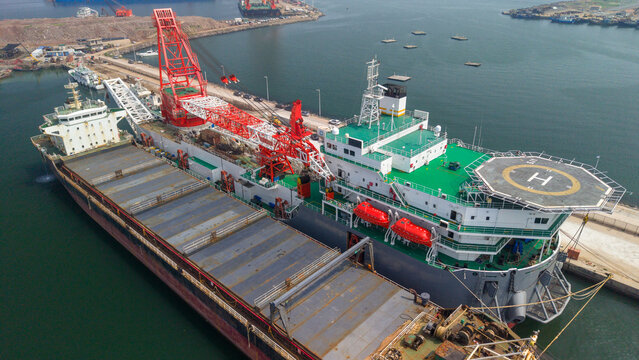 Specialized Offshore Construction Vessel Docked at Port