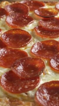 Close up of delicious pepperoni pizza with melted cheese