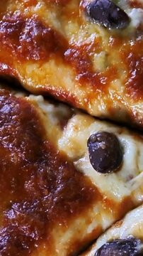 Close-up of Delicious Freshly Baked Pizza with Black Olives