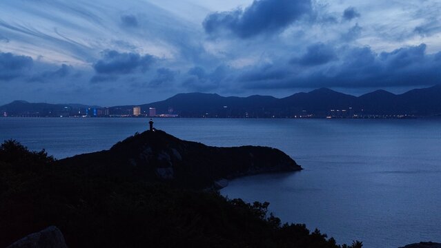Landscape view of a lighthouse during blue hour in Putuo Mountains (Zhejiang Province, China)