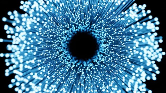Blue light particles expanding and swirling in motion