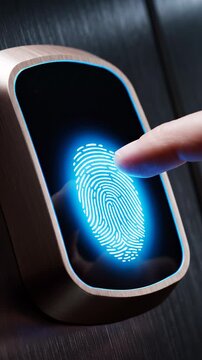 Close-up of a human finger pressing a biometric fingerprint scanner for secure digital access and identification