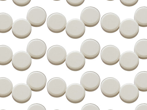 Varias pastillas de color blanco en un fondo transparente 