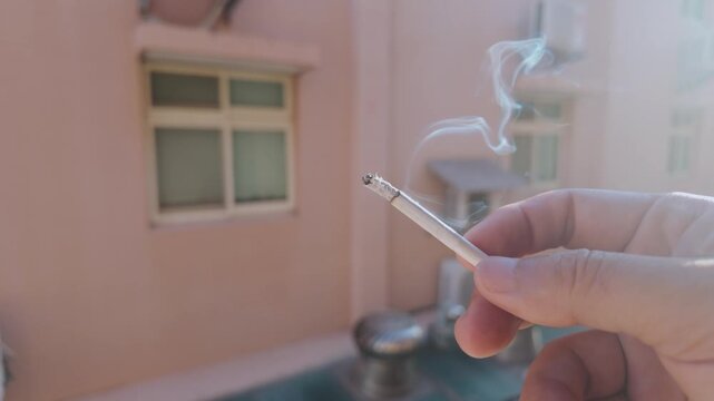 Cigarette Smoke in Morning Sunlight by Apartment Window Time Lapse