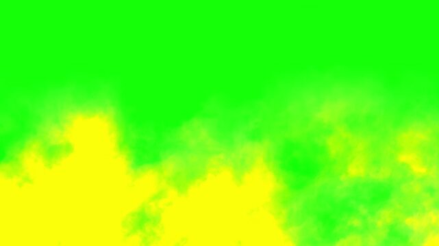 Smoke rises in thick yellow plumes across a bright chroma key green screen providing a versatile element for digital compositing and visual effects.