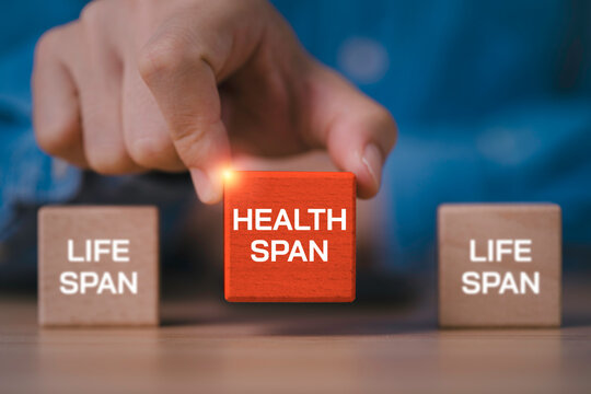 Health span and life span concept with a hand highlighting healthy longevity, symbolizing extending years in good health through preventive healthcare, healthy aging, wellness and quality of life.
