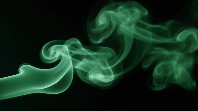 Swirling green smoke plumes flowing smoothly against a dark background, ideal for motion graphics and visual effects overlays.