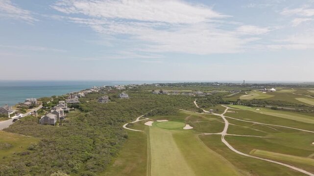 Aerial shot of Sanity Head Golf Club in Nantucket, Massachusetts during a sunny summer day. Plush, green fairways with Atlantic Ocean views