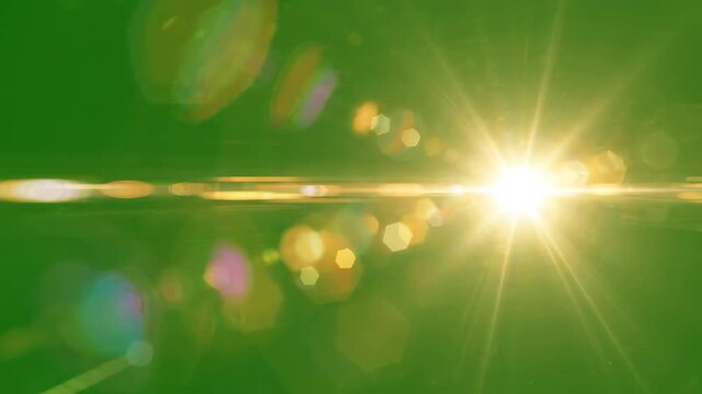 Cinematic lens flare with bright light leaks and optical glows moving across a solid green screen background for video editing overlay
