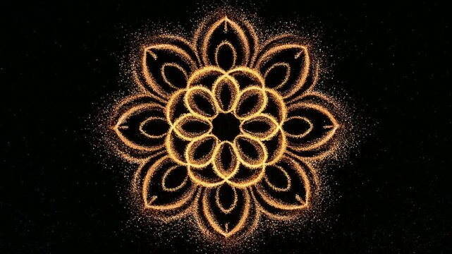 金色の砂絵が描く花模様の曼荼羅
