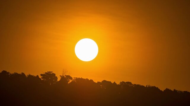 Beautiful morning sunrise time-lapse, clear sky and bright sun light coming up.