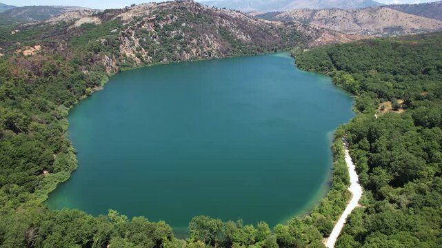 Aerial Panoramic View of Ziros Lake in Preveza Greece, Hidden Forest Lake with Blue-Green Waters
