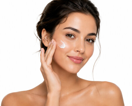 Woman applying skin care cream
