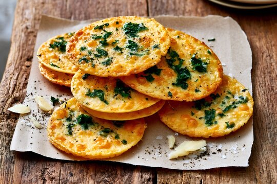 Parmesan frico kale crisps on rustic wood