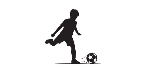 A young boy playing soccer captured in a striking silhouette © MdMufassel