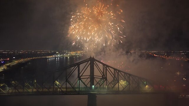 Montreal fireworks over Jacques Cartier Bridge and La Ronde amusement park at night, Quebec, Canada. g.