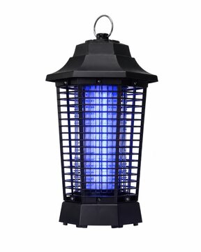 Electric mosquito killer lamp glowing in dark. Insect zapper device for pest control at night with blue UV light.