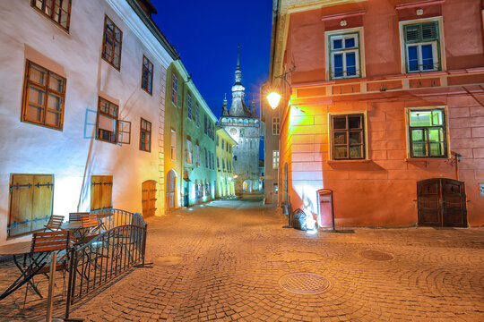 Remarkable evening view of historic town Sighisoara and Clock Tower built by Saxons.