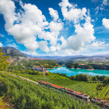 Gorgeous View of the Cles Castel, the Santa Giustina Lake and lots of apple plantations.