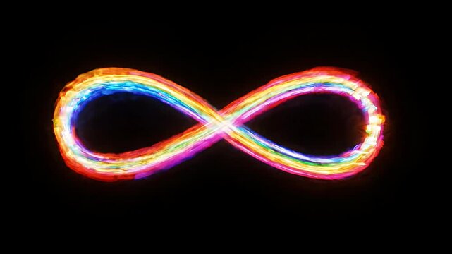 Colorful light painting forming infinity shape in darkness.