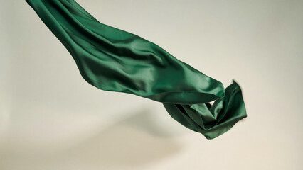 Fototapeta premium Abstract green silk wave floating mid-air with floating abstract material movement aesthetic