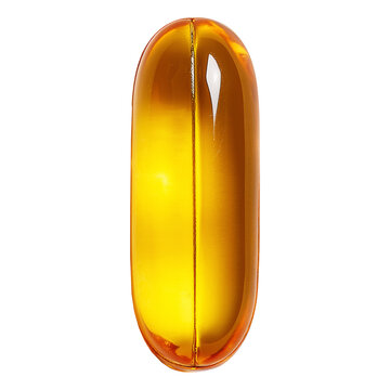 Transparent  yellow glossy gel capsule pill isolated on white studio background, concept of health and medicine