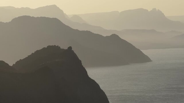 Golden dusk over the desert mountains and calm sea near La Paz Baja California Sur