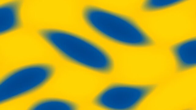 Abstract blue and yellow pattern with blurred oval shapes