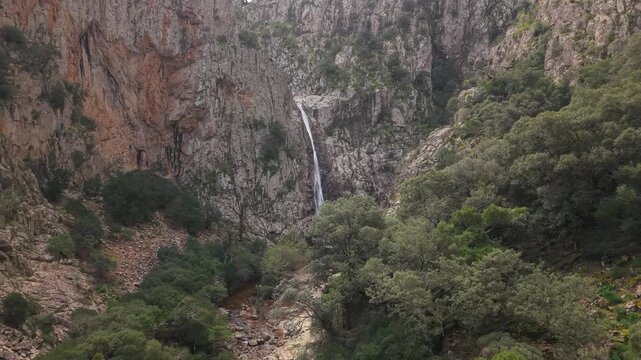 Piscina Irgas Waterfall In The Monte Linas Park Near Villacidro, Sardinia, Italy. - aerial push-in shot