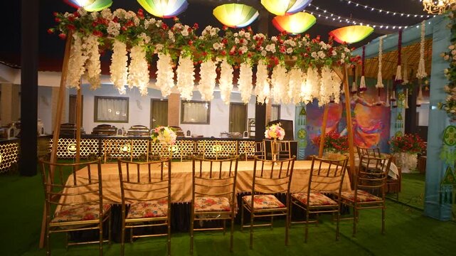 Indian wedding sangeet stage setup. Decorated banquet hall for traditional marriage ceremony.