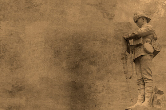 World War 1 remembrance soldier statue image on a sepia grunge background backdrop. Remembrance armistice day design concept