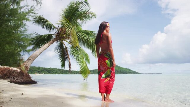 Tahiti luxury beach bikini Asian woman on French Polynesia cruise ship travel Bora Bora vacation. Beautiful model enjoying sun tan on polynesian island. Video of real woman without makeup