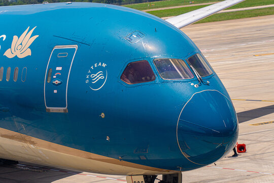 Close-up of the cockpit and nose section of a commercial airplane at Tan Son Nhat Airport