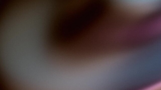 Abstract grainy background with gradient color blur and moody lighting