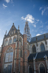 Fototapeta premium The Grote Kerk or St.-Bavokerk is a Dutch Reformed Protestant church and former Catholic cathedral located in the central market square
