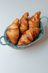 Diamond-shaped croissants isolated on a light background © Cavan